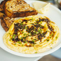 Scrambled eggs with black lime za’atar crisp, sourdough and cultured butter.