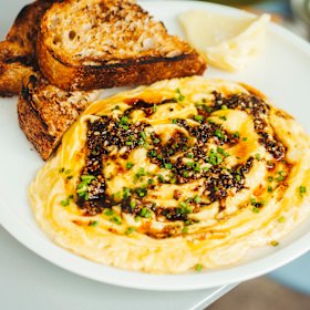 Scrambled eggs with black lime za’atar crisp.
