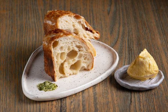 Dark-crusted slices of house-made bread with kefir and miso butter. 