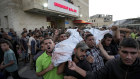 Palestinians mourn as they carry the bodies of relatives killed in the Israeli bombardment of the Gaza Strip at a hospital in Deir el-Balah, Sunday, Oct. 20, 2024.