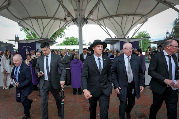 Well suited on arrival at Derby Day, Flemington.