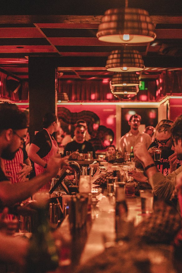 Plentiful seating along the red-hued bar.