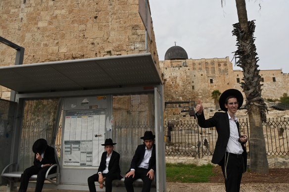 Orthodox Jewish males in front of the Al Aqsa Mosque compound in Jerusalem.