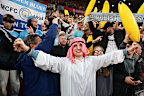 Fans of Manchester City celebrate.