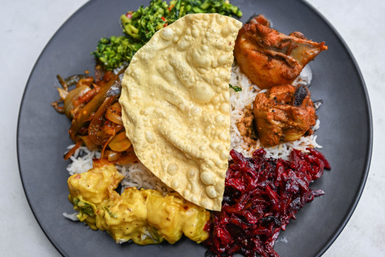 White rice; kale mallum; chicken, beetroot and cassava curries; pappadum.