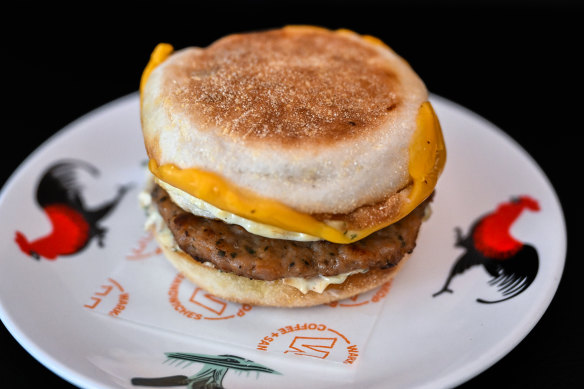 A breakfast muffin with sausage, egg, cheese and “Bazzinga” sauce at Warkop in the Melbourne CBD.