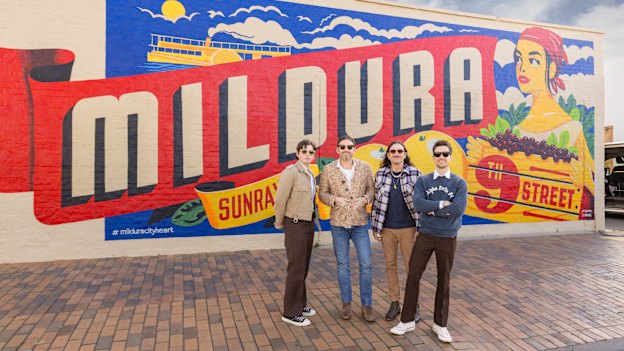 Kings of Leon, l-r: Matthew Followill (lead guitar), Caleb Followill (lead vocals, guitar), Nathan Followill (drums) and Jared Followill (bass) in front of the Mildura mural.