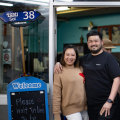 Soi 38 restaurant’s owners Tasha Piyaphanee and Top Piyaphanee outside the restaurant in a carpark.