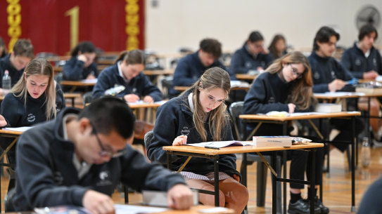 Students sit VCE exams.