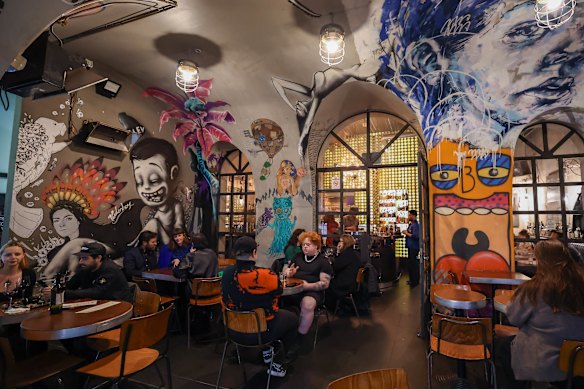 Bar Ampere's concrete tunnel swept with bohemian artworks.