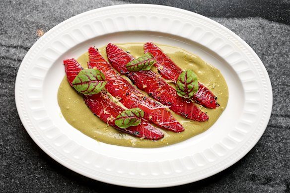Beetroot-cured salmon gravlax with sorrel sauce.