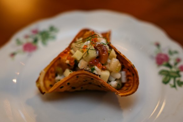 Spanner crab tart with savoury pandan custard and compressed nashi pear.