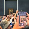 Shuffled into a pen like cattle, you’re more likely to see the Mona Lisa through your phone screen afterwards.