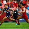 GOLD COAST, AUSTRALIA - MAY 31: Shai Bolton of the Dockers and Wil Powell of the Suns compete for the ball during the 2025 AFL Round 12 match between the Gold Coast Suns and the Fremantle Dockers at People First Stadium on May 31, 2025 in the Gold Coast, Australia. (Photo by Russell Freeman/AFL Photos via Getty Images)