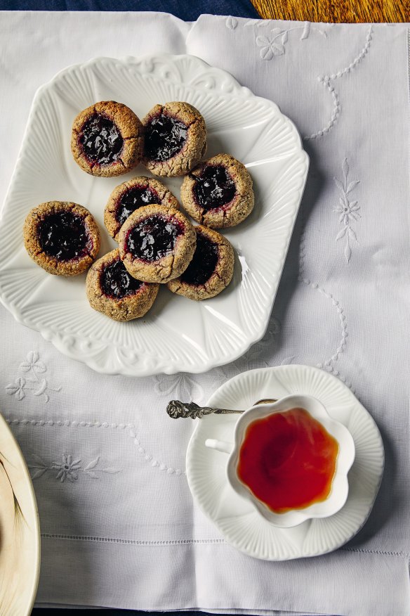 Flourless hazelnut cookies with wattleseed and cherry.