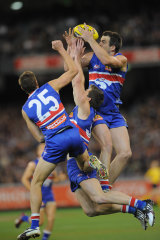 Brian Lake marks over his teammates.