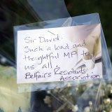 Flowers are laid near the Belfairs Methodist Church where British MP David Amess was killed. 