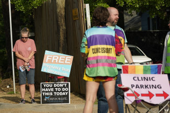 For years, women in rainbow-coloured vests have escorted patients at the pink house past the anti-abortion portesters. 