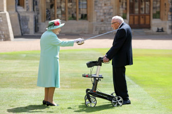 The Queen knights Captain Tom Moore, who said he wouldn't kneel "because if I did I'll never get up again".