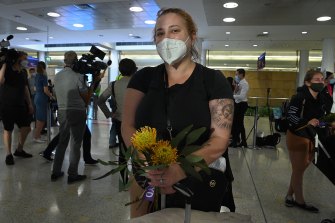Emma Arzoumanian was among passengers given posies of Australian native flowers and gum leaves as they arrived at Sydney International Airport on Monday morning.