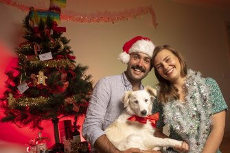 Poppy Cook, partner Ryland Mollard and dog Leila have gotten into the Christmas spirit early this year.