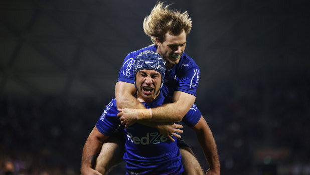 Jahrome Hughes celebrates a try with Ryan Papenhuyzen.