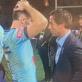 Andrew Johns and Nathan Cleary share a private moment on the field after the Origin decider.