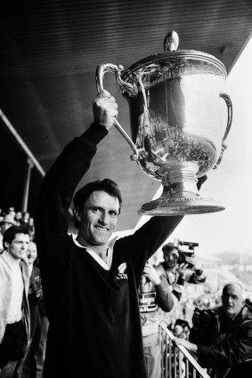 Andrew Slack hoists the Bledisloe Cup after the traditional jersey swap with his opposite number.