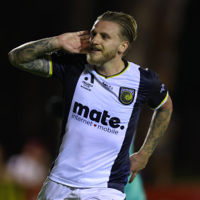 Jason Cummings of the Mariners celebrates a goal.