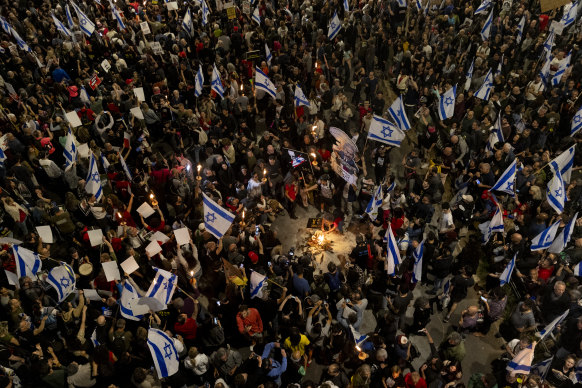 Protesters light a fire during a demonstration calling for a hostages deal and against the Israeli government, Tel Aviv.