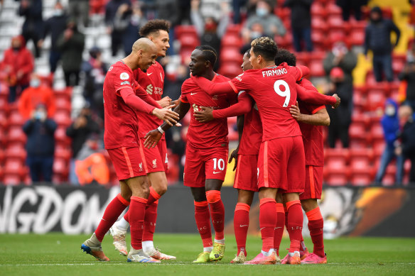 Sadio Mane celebrates with his Liverpool teammates after scoring against Crystal Palace.