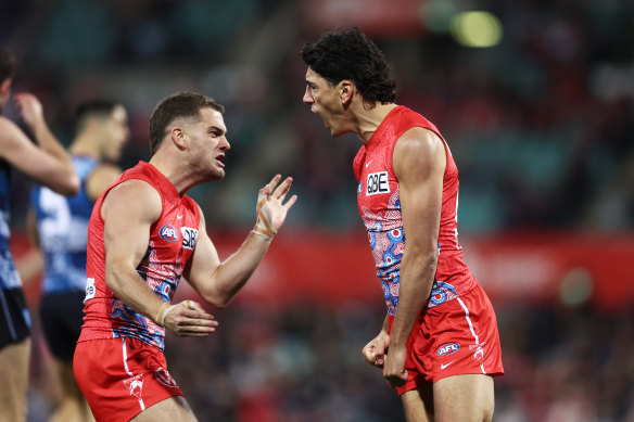 Justin McInerney of the Swans celebrates with Tom Papley of the Swans.