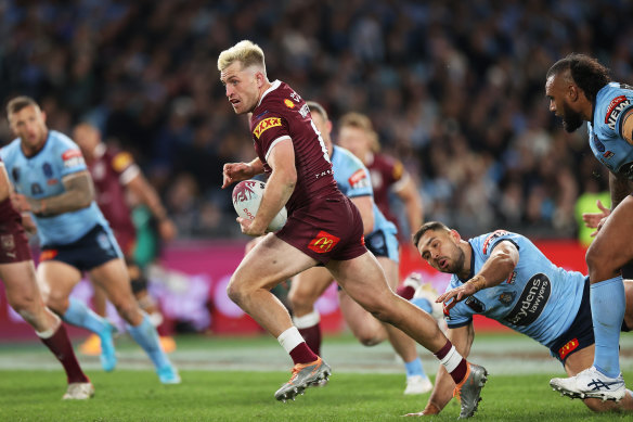 Cameron Munster makes a break during his man-of-the-match performance in Origin I.