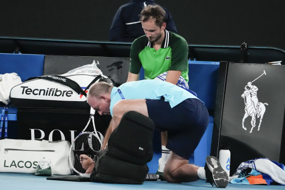 Medvedev has a blister attended to by a trainer during his second round match against Ruusuvuori.