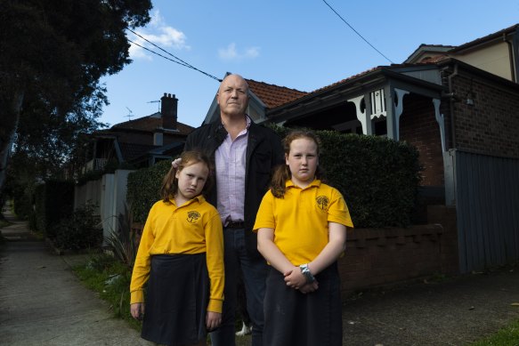 Sam Espie, pictured with his daughters Jessica and Violet, bought his  Queens Park property in 2010 and says it has never flooded.