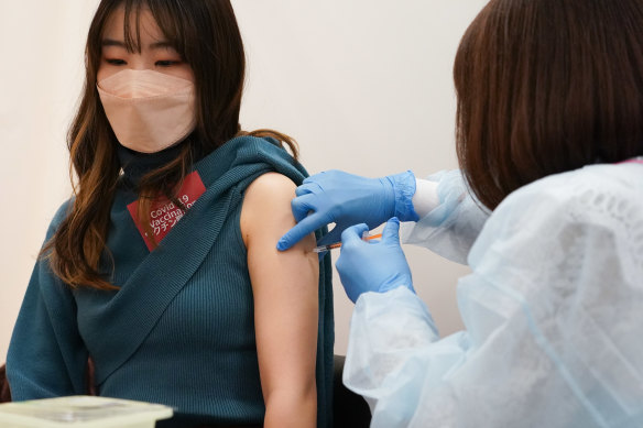 A woman receives a dose of the Moderna COVID-19 vaccine. 