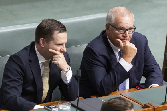 Alex Hawke and Scott Morrison during Question Time yesterday.