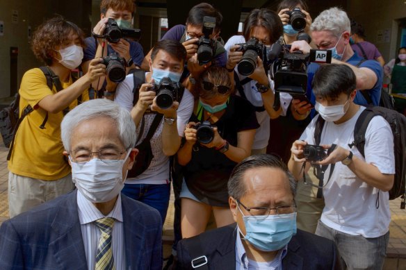 Pro-democracy lawmaker Martin Lee, left, and Albert Ho arrive at a court in Hong Kong on Thursday, April 1, 2021. 