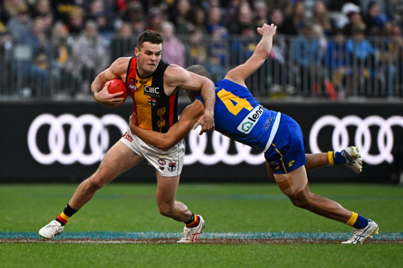 St Kilda’s Brad Crouch is tackled by Dom Sheed.