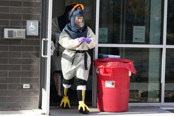 Nurse Lee Cherie Booth gets ready to administer coronavirus tests dressed as a turkey outside the Salt Lake County Health Department in Salt lake City, Utah, US.