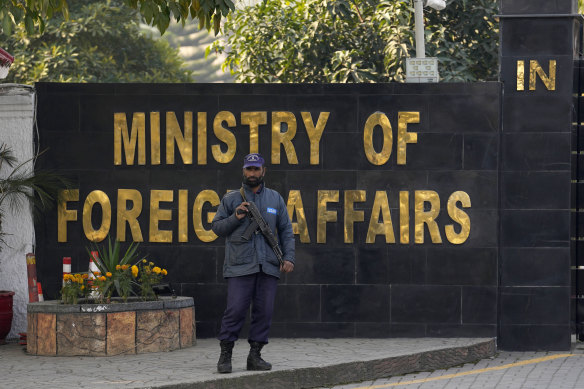 A police officer stands guard at the main entry gate of Pakistan’s Ministry of Foreign Affairs in Islamabad.