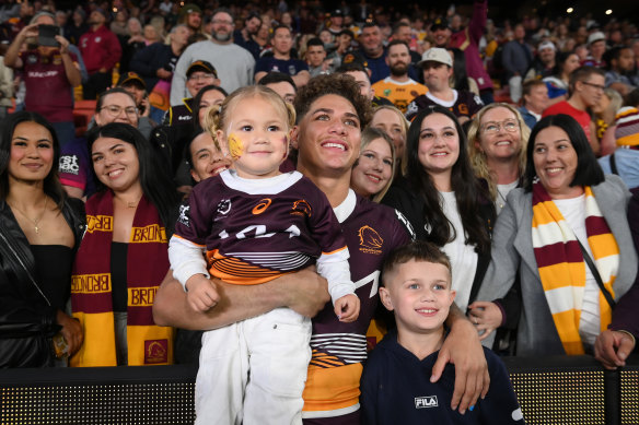 Reece Walsh poses for a photo with the Brisbane crowd.