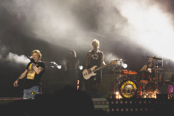Original Guns N’ Roses members Axl Rose (left) and Duff McKagan (centre) perform at Sydney’s Accor Stadium.