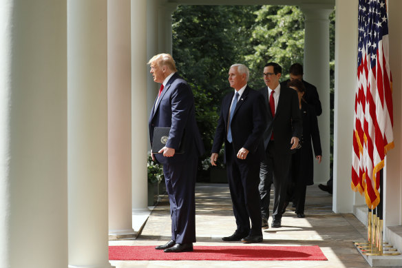 US President Donald Trump arrives in the White House Rose garden to laud Friday's figures.