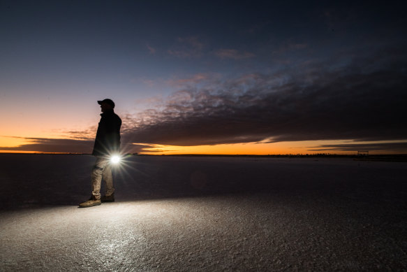 Farmer Rohan Mott on Lake Tyrrell at dawn. 
