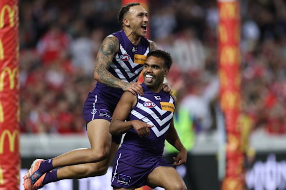 Shai Bolton and Isaiah Dudley celebrate a crucial goal in their thrilling win over Sydney.
