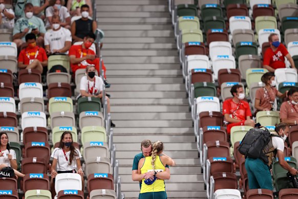 Kelsey-Lee Barber hugs her coach and husband, Mike, after winning bronze.