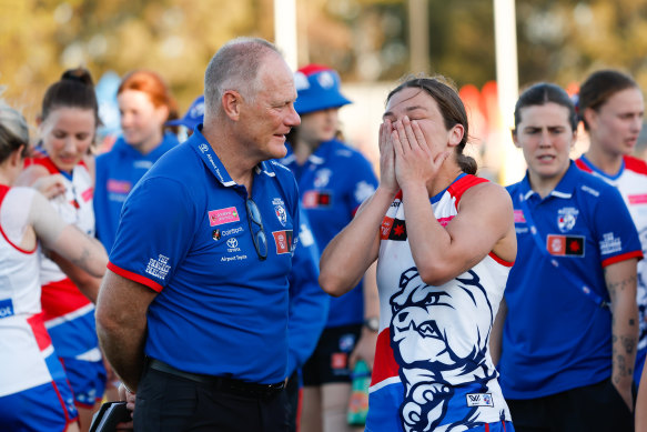 Nathan Burke and captain Ellie Blackburn chat during the loss to the Demons.