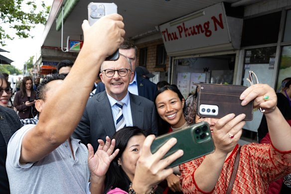 Albanese is mobbed by supporters on a street walk in the Sydney suburb of Cabramatta.