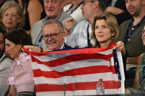 US ambassador Caroline Kennedy brings out the stars and stripes to cheer Tommy Paul.